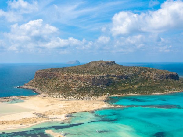 Photograph of an island and low sand bar.